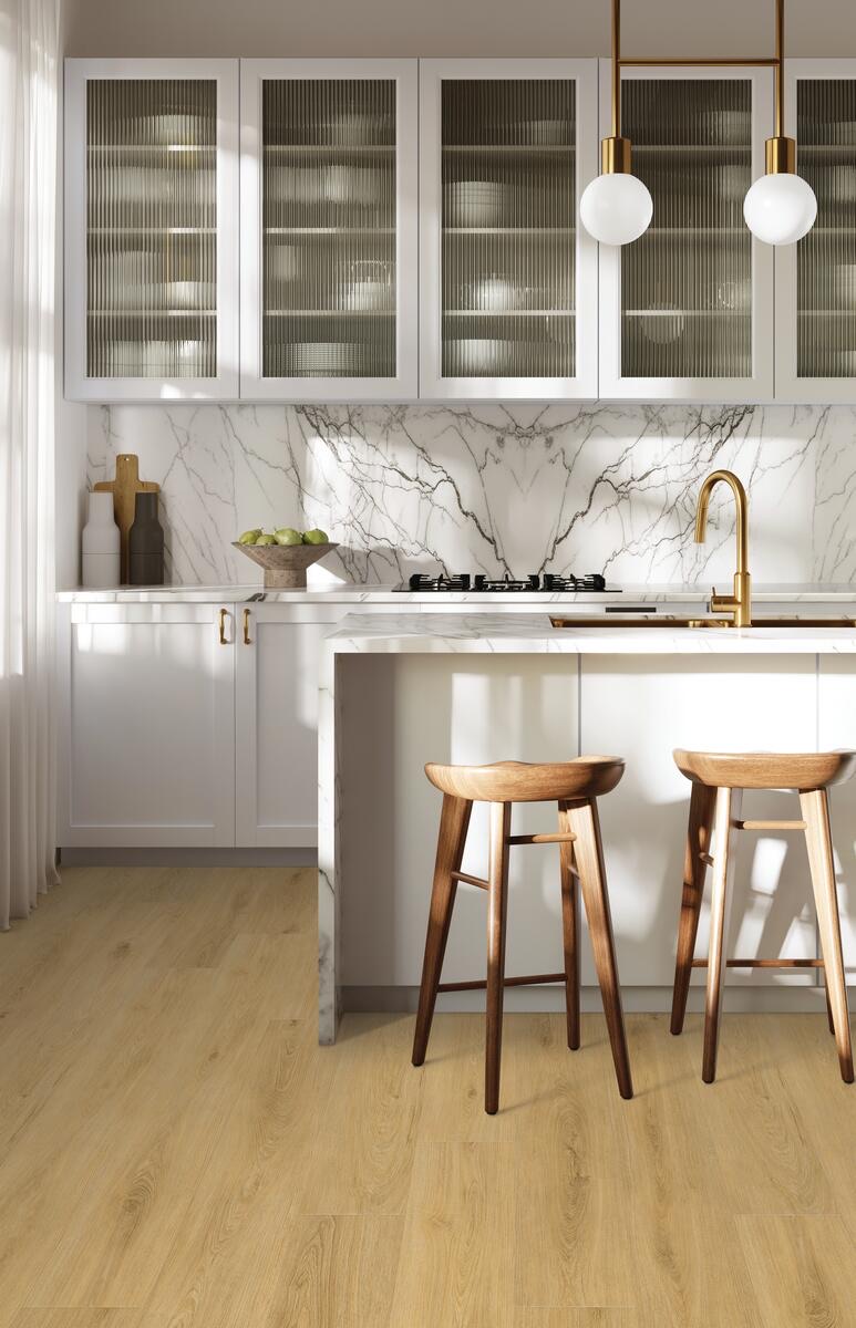 White kitchen with marble backsplash, brass faucet and pendant lights